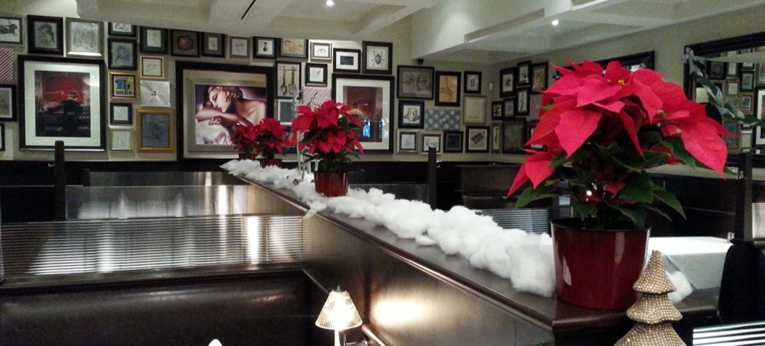 Poinsettias arranged for the holiday season in a Los Angeles hospitality space